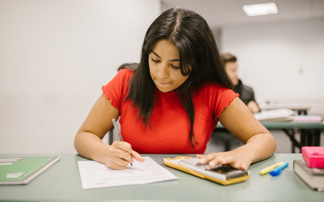female-student-answering-a-level-maths-paper-2024